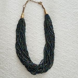 Iridescent purple and teal torsade necklace